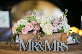Mr. & Mrs. sign with flowers